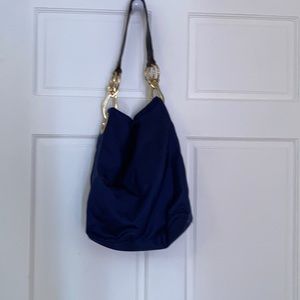 JPK Navy blue with gold and brown handles.